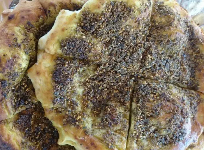 Manakish -- pita bread with za'atar spices. 